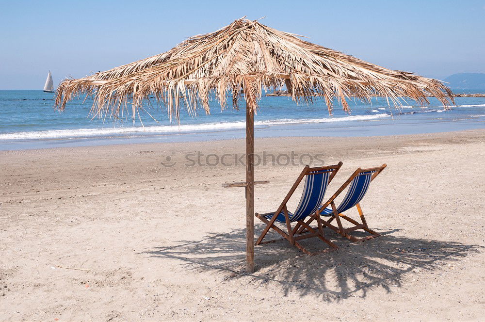 Similar – Straw umbrellas on the beach