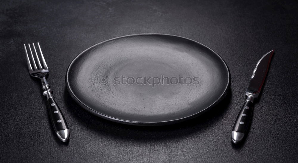 Similar – Half empty white plates, vintage knife and fork