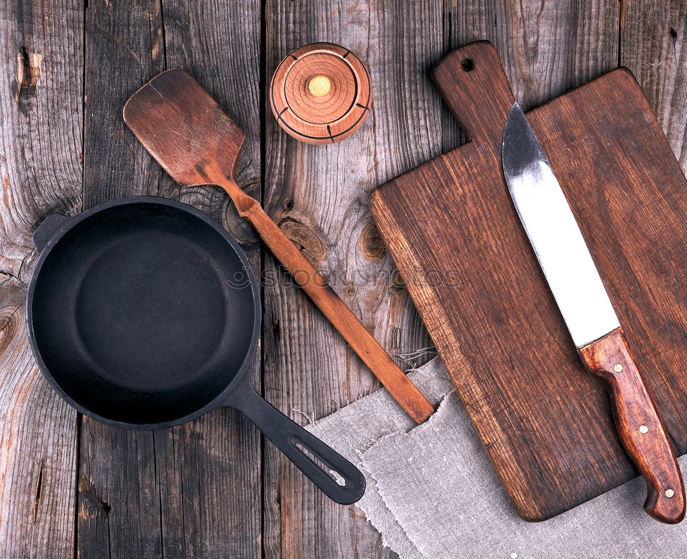 Similar – Image, Stock Photo Empty black cast-iron frying pan with vintage kitchen items