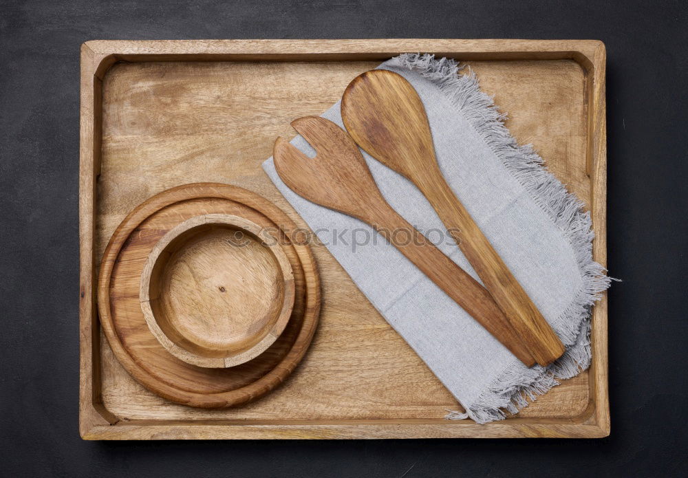 Similar – Black cast-iron frying pan with a wooden spatula