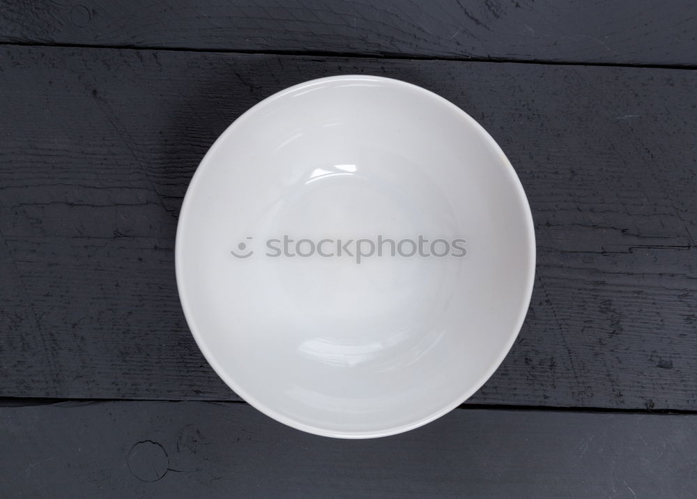 Image, Stock Photo Empty bowl on black wood in bird’s eye view