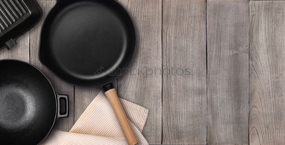 Similar – Empty grill pan with wooden spatula and spoon