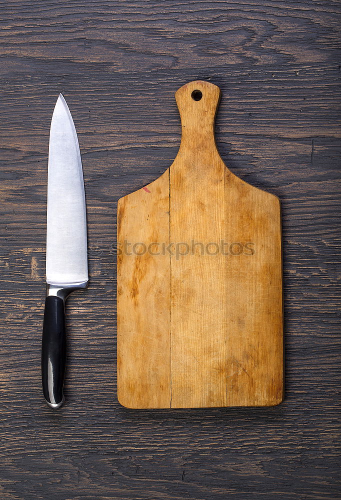 Similar – Old hatchet an a wooden cutting board, top view