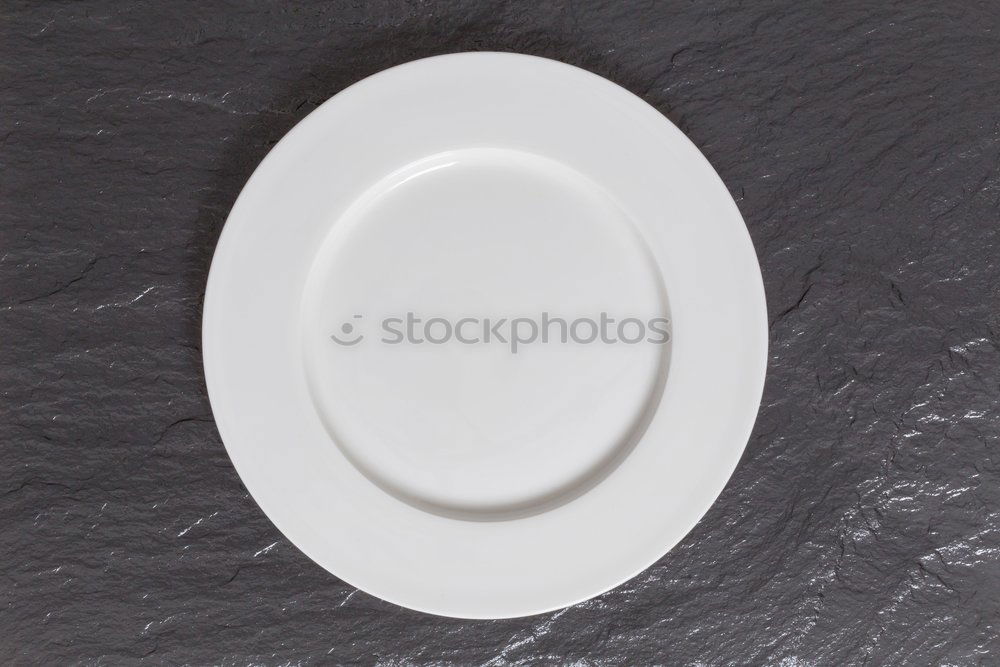 Similar – Image, Stock Photo Empty bowl on black wood in bird’s eye view