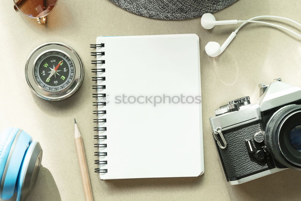 Similar – Camera, glasses and notepad on wood