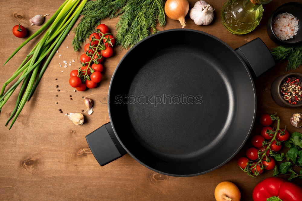 Similar – Image, Stock Photo Empty wok pan on kitchen table with chopsticks and vegetarian Asian food ingredients, top view. Copy space.  Healthy eating and cooking