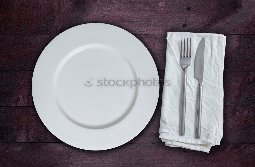 Similar – Half empty white plates, vintage knife and fork