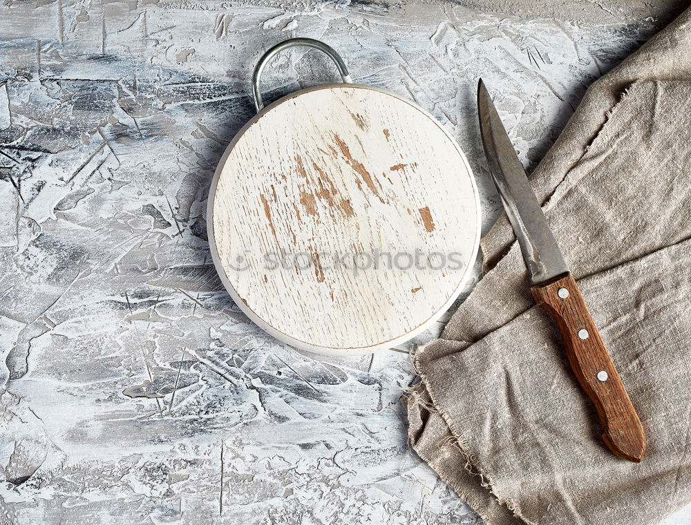 Similar – cast iron pan with a spatula on a gray textile napkin