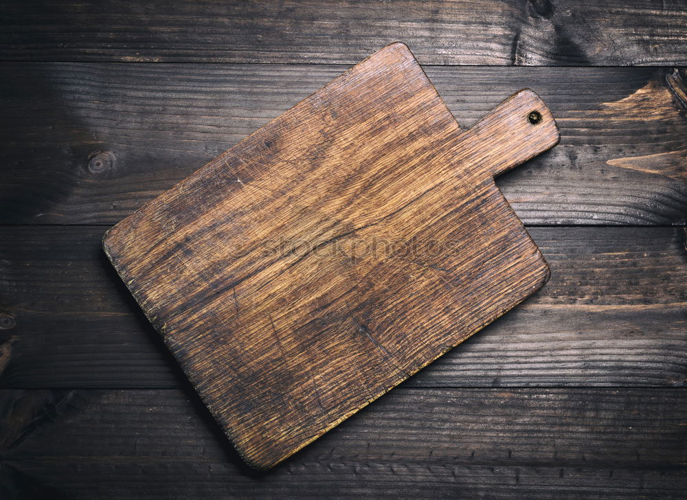 Similar – Empty very old wooden kitchen cutting board