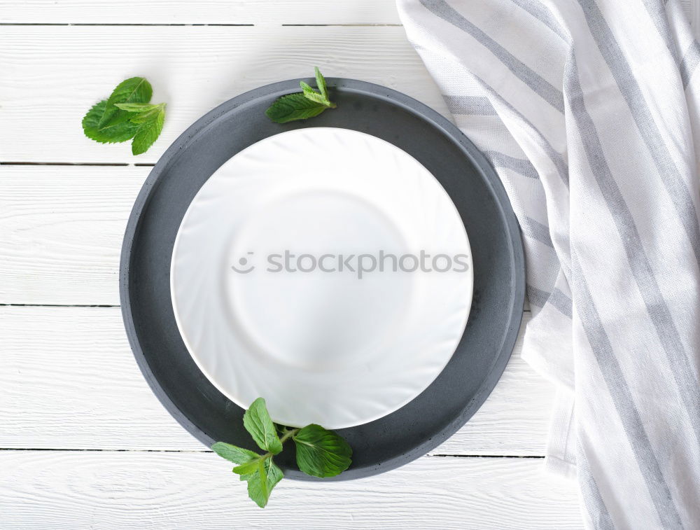 Similar – White plate with vintage iron cutlery