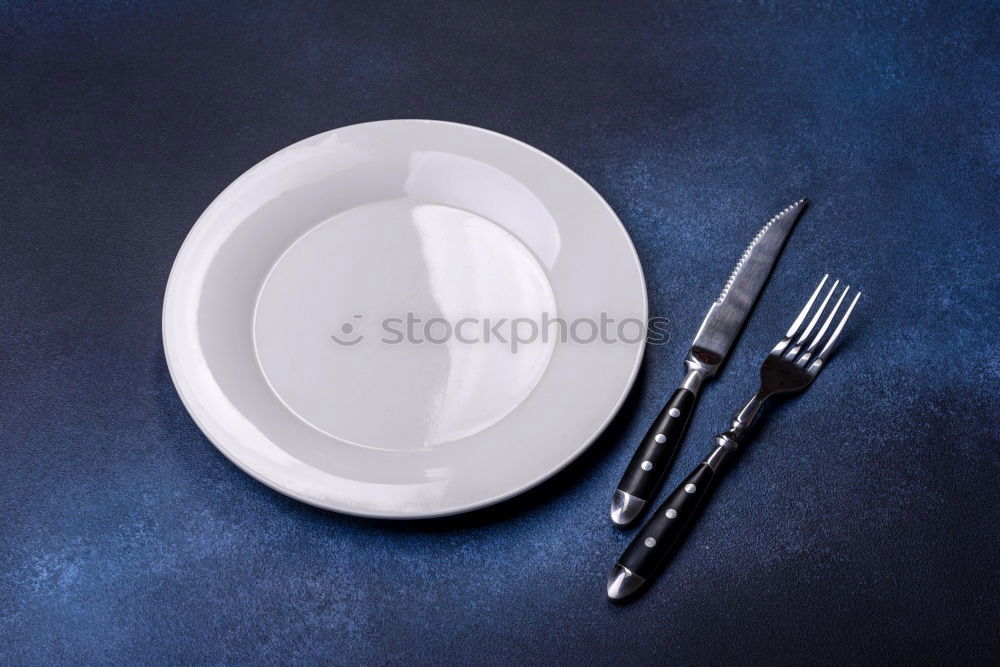 Similar – white square plate and iron cutlery