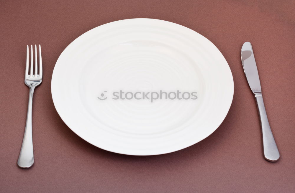 Similar – Half empty white plates, vintage knife and fork