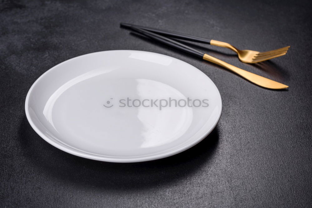 Similar – White dish with iron cutlery