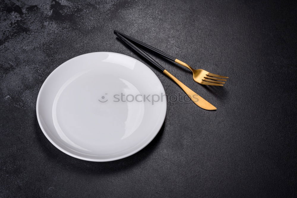 Similar – White empty plate and metal vintage knife and fork