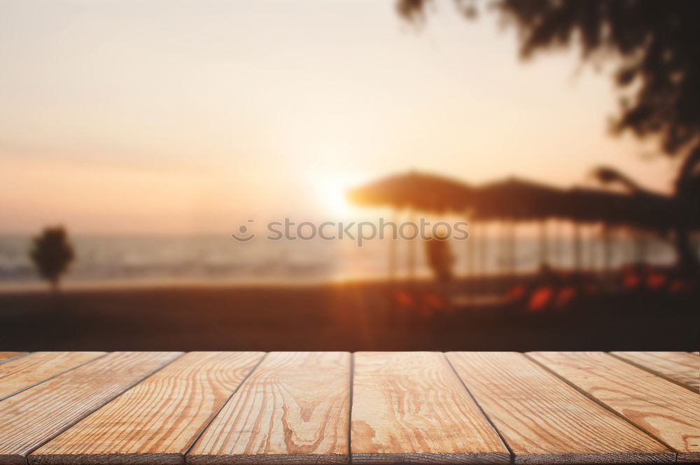 Similar – Image, Stock Photo Beach umbrellas in sunset light