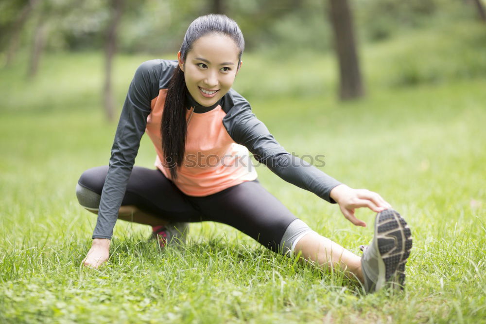 Similar – Athletic young woman doing push up exercises