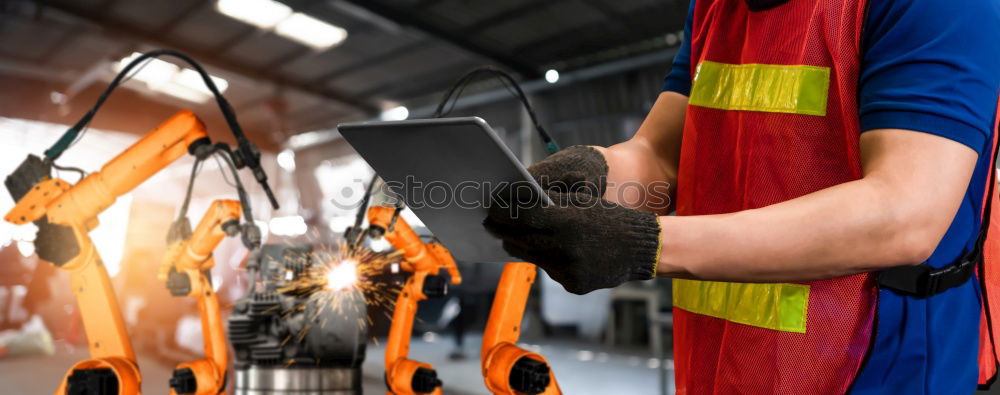 Similar – Professional Mechanic Repairing Car.