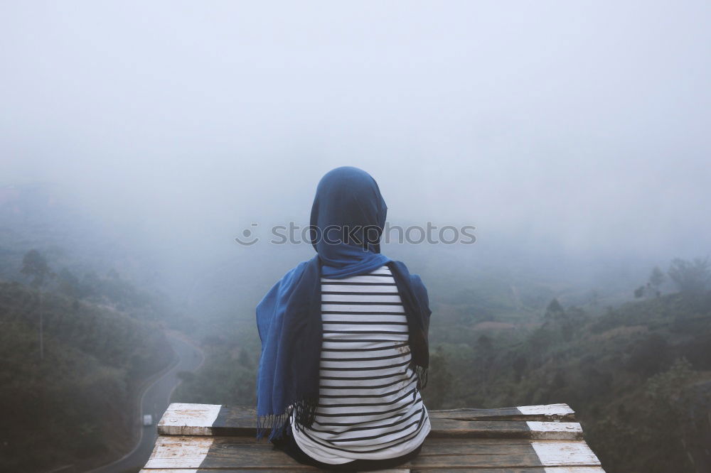 Similar – Image, Stock Photo Girl walking on a mountain road with a lot of fog