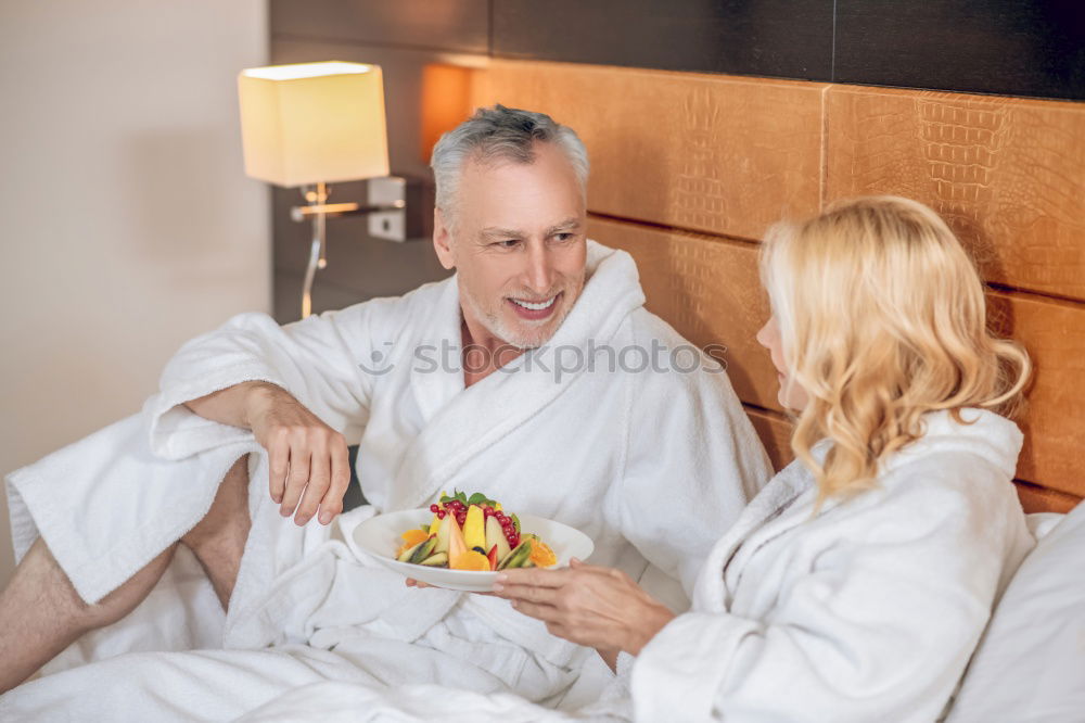 Similar – Image, Stock Photo Couple having breakfast in hotel