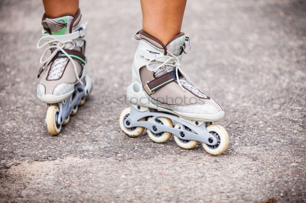 Similar – A pair of roller skates on the sidewalk.