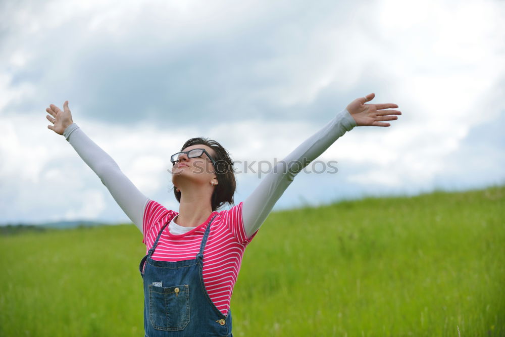 Similar – Image, Stock Photo Woman with wind ruffled hair looks up