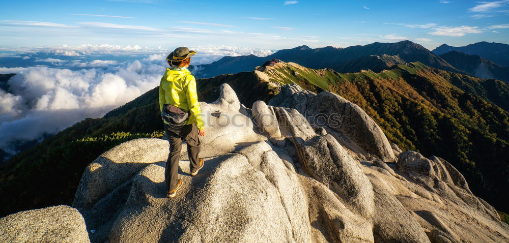 Similar – Image, Stock Photo Male rock climber clinging to a steep cliff.