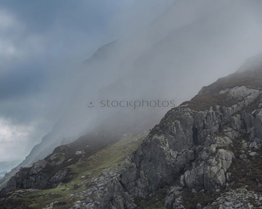 Similar – A photographer takes pictures of the view on Isle of Skye