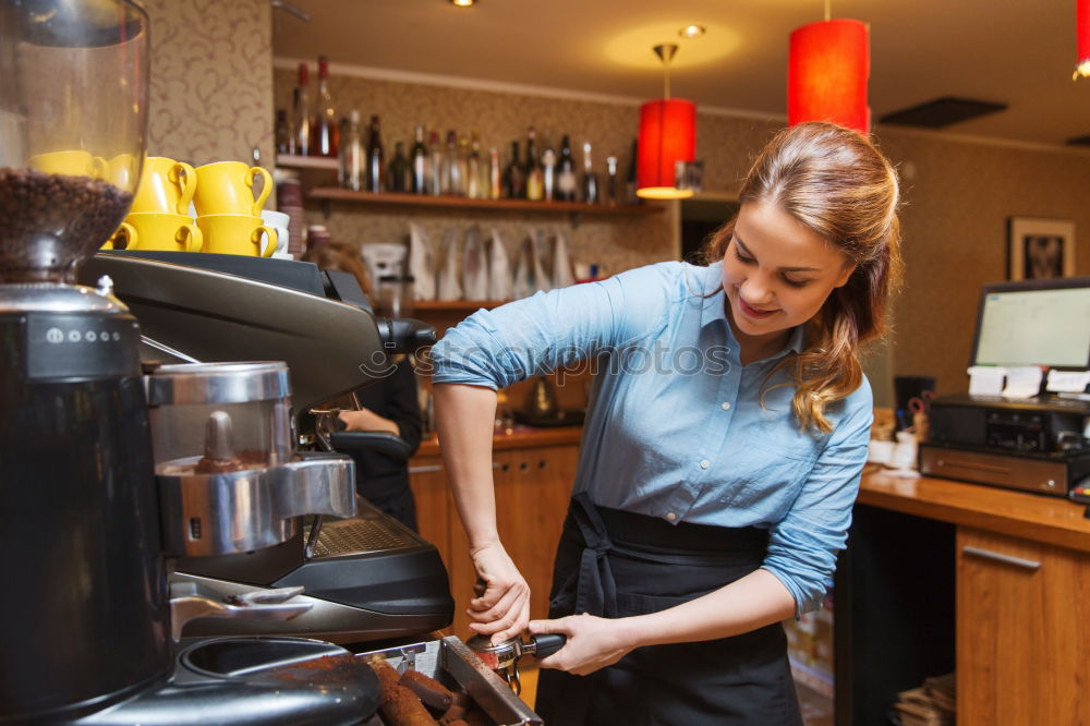 Similar – smiling Barista girl prepares coffee