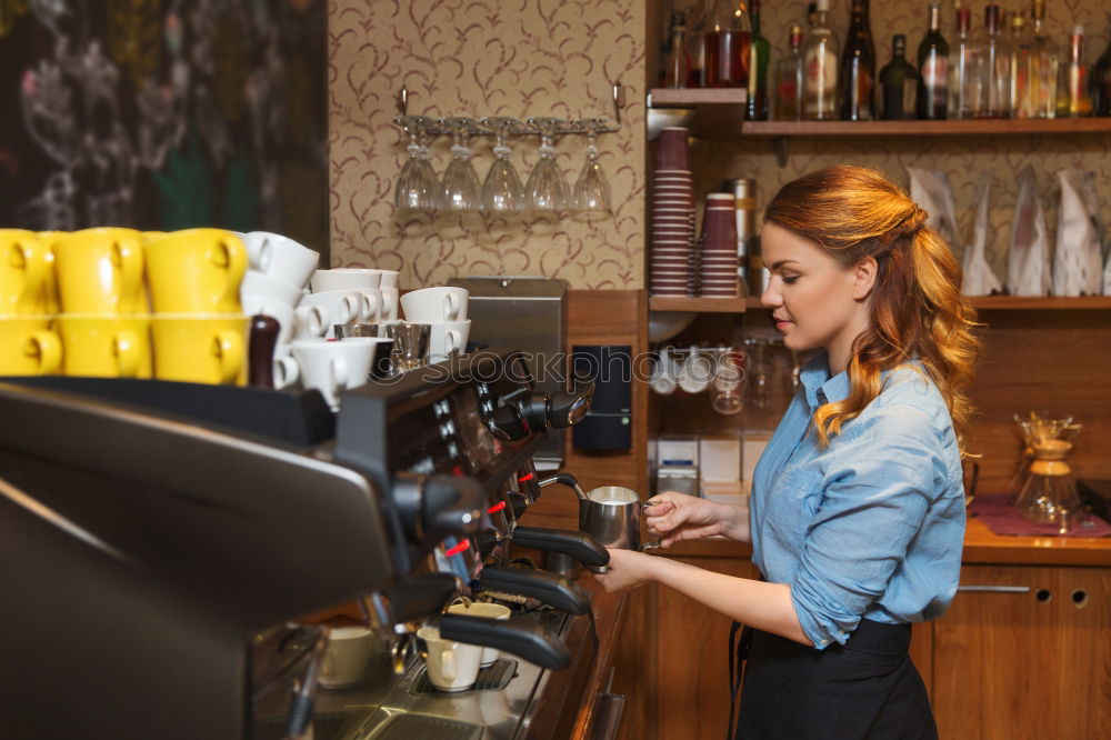 Similar – smiling Barista girl prepares coffee