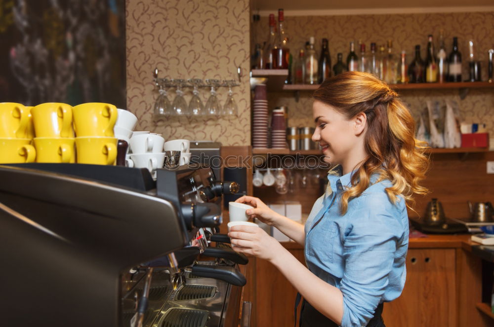 smiling Barista girl prepares coffee