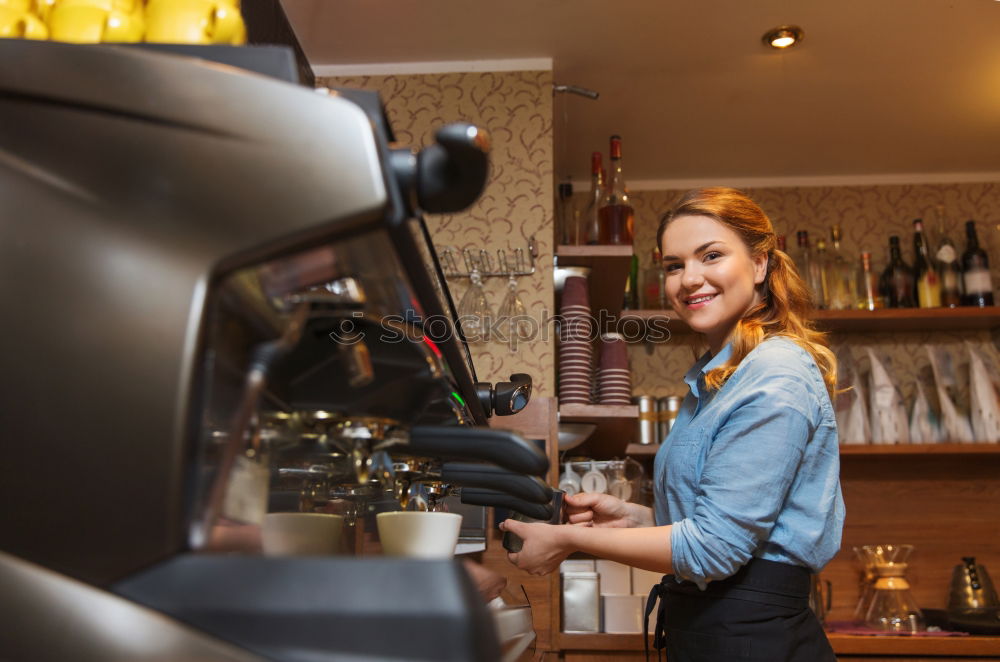 Similar – smiling Barista girl prepares coffee