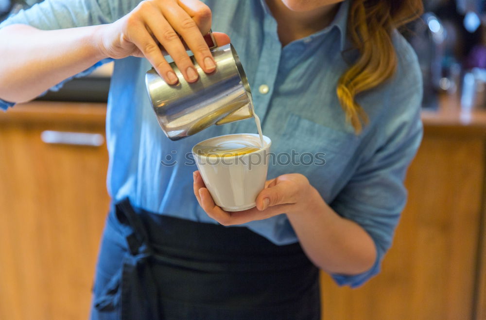 Similar – Image, Stock Photo Barista holds out a Cup of coffee