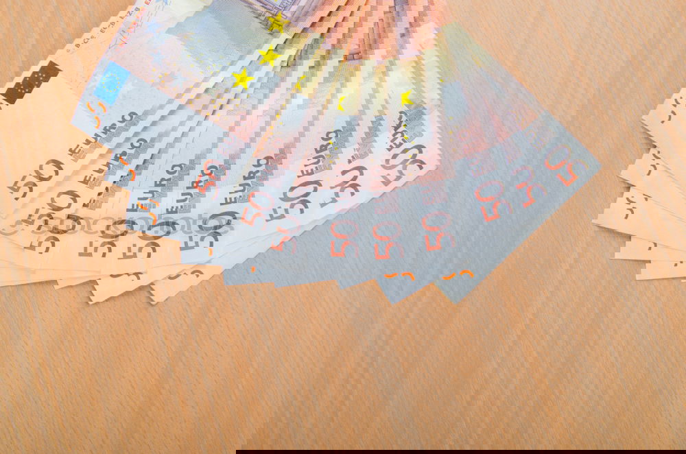 Similar – Image, Stock Photo Payday | hands of a young woman and many banknotes standing on the table before her.