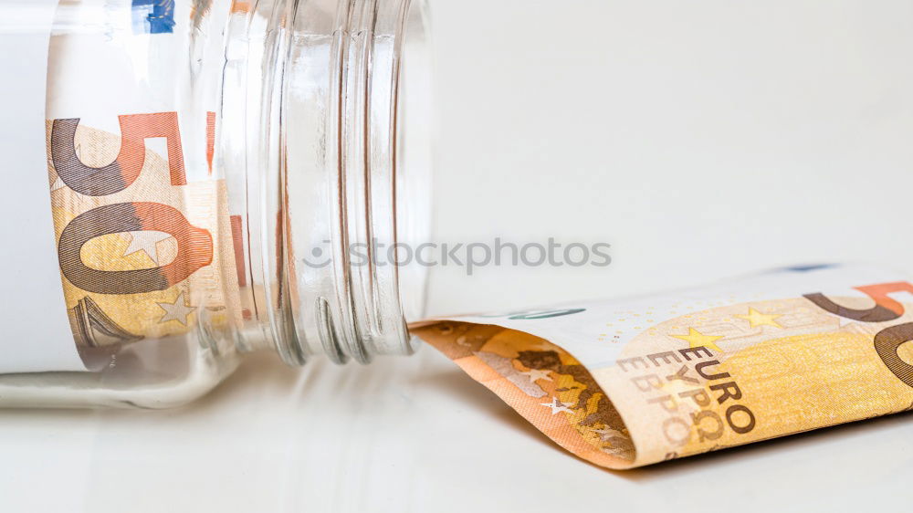 Similar – Image, Stock Photo Euro 50 value banknotes roll with rubber on gray background