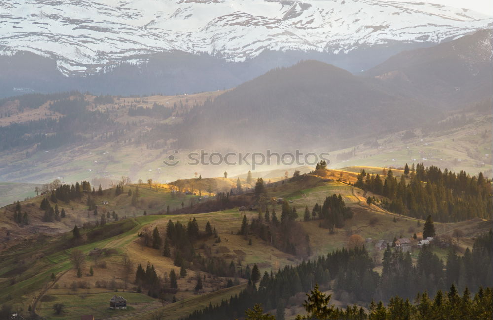 Similar – Image, Stock Photo Snow caped mountains and green fields and meadows