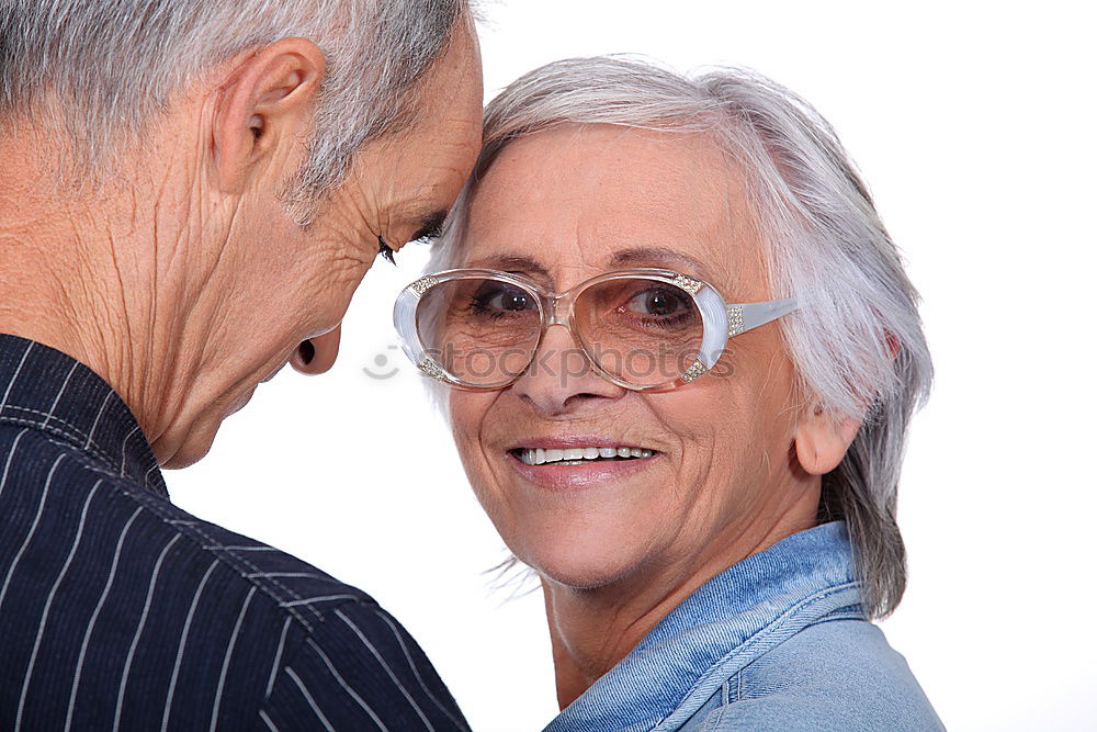 Similar – Smiling senior couple looks lovingly into each other’s eyes