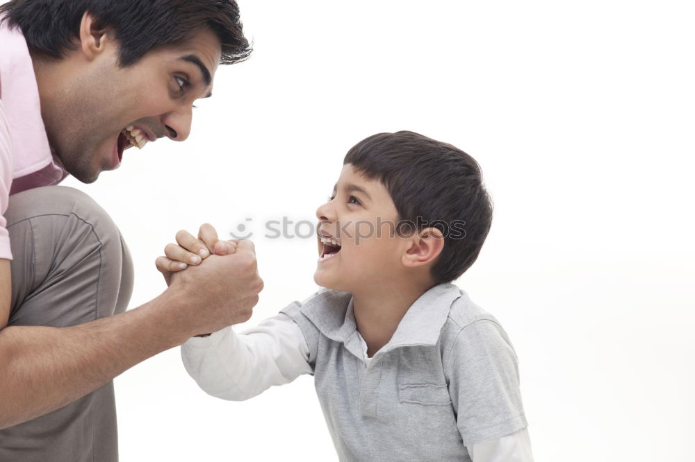 Similar – sad son hugging his dad near wall at the day time