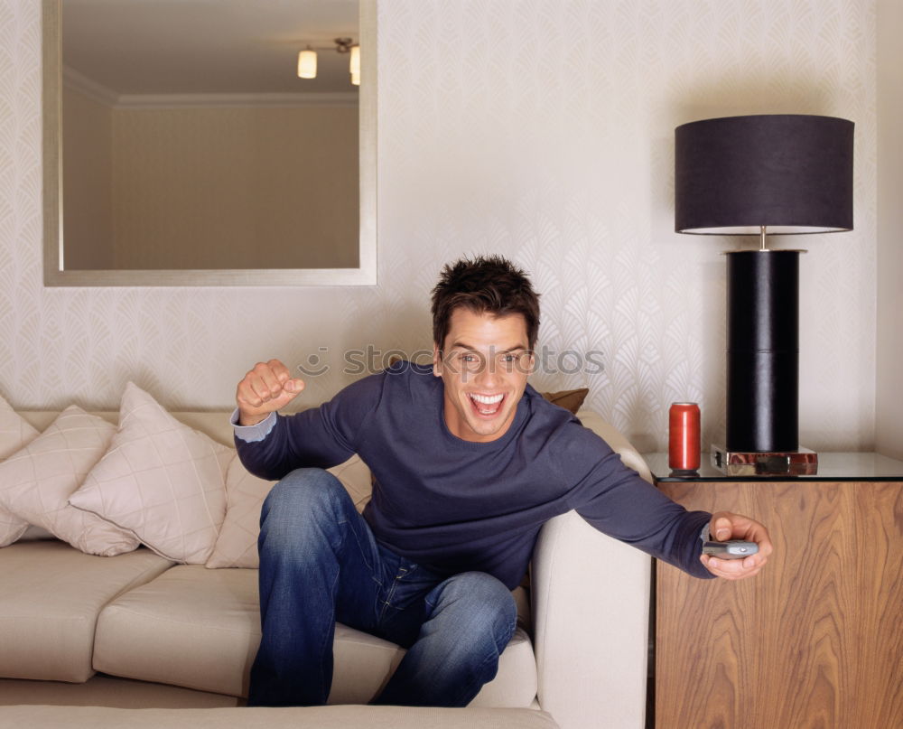 Similar – Image, Stock Photo man use remote control to watch tv