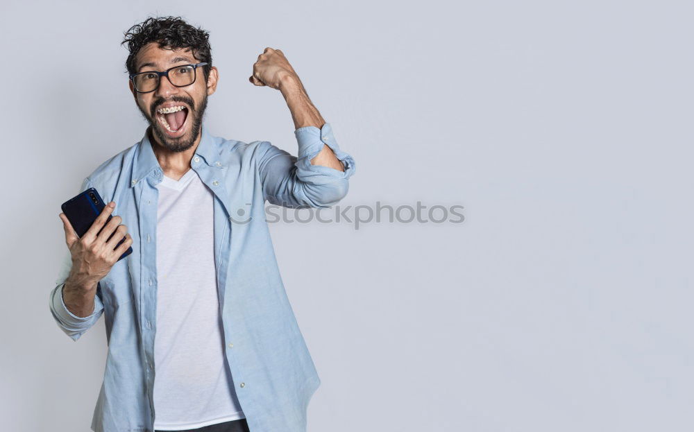 Similar – Business man with mobile phone in his hand