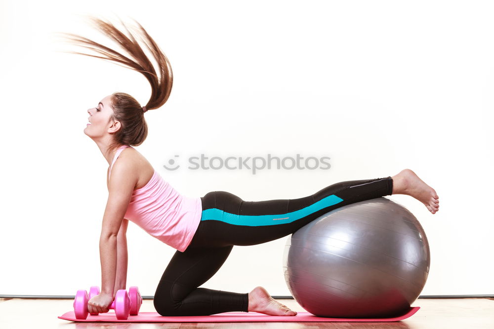 Similar – CHICA CON UNA PELOTA DE PILATES HACIENDO ESTIRAMIENTOS