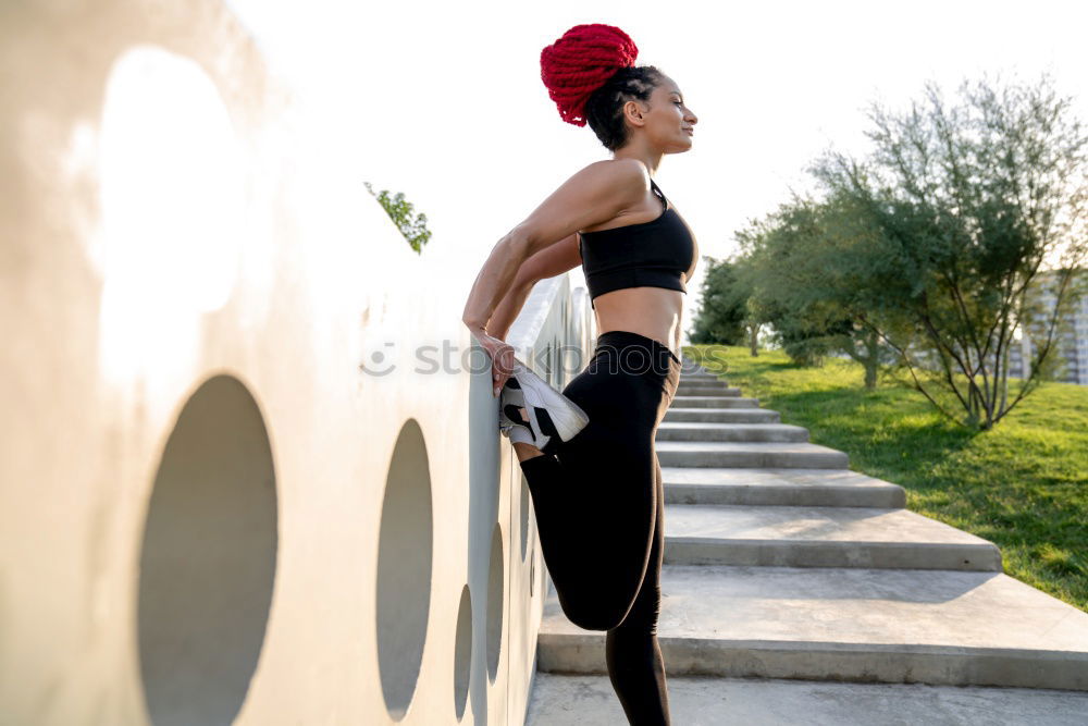 Similar – Woman tying hair in ponytail getting ready for run.