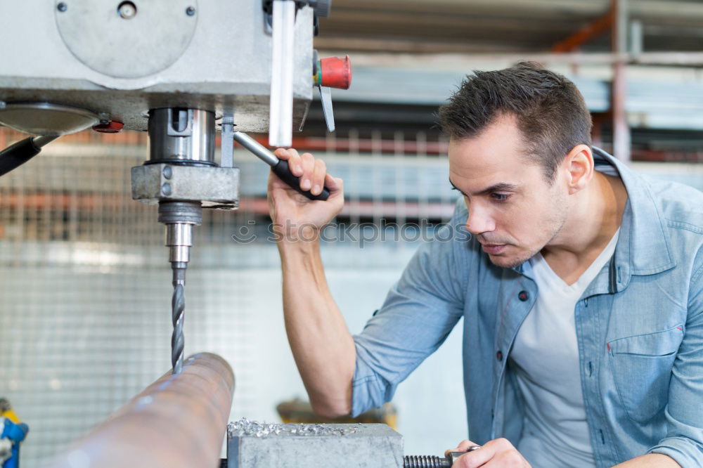 Similar – Professional Mechanic Repairing Car.