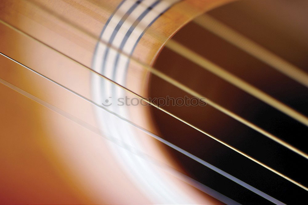 Similar – Image, Stock Photo Ukulele Hawaiian small guitar music instrument at sunset closeup photo. Beige brown gold colour palette shot with ukulele lying on windowsill in soft natural light.