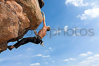 Similar – Rock climber falling upside down.