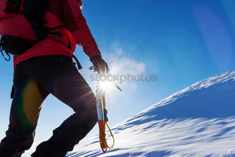 Similar – Image, Stock Photo Climber at the top of a snowy peak in the Alps.