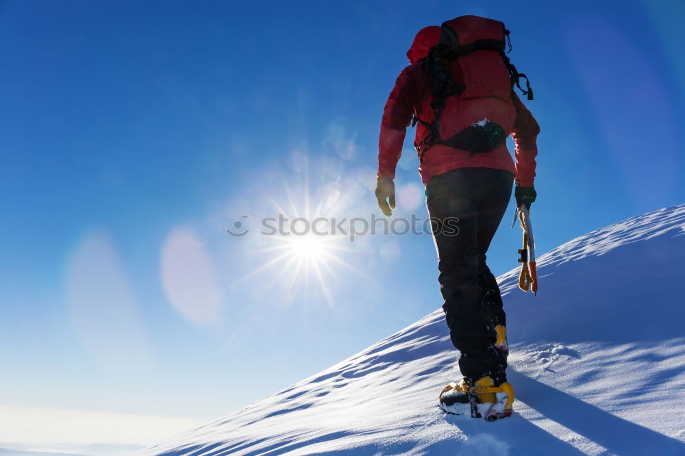 Image, Stock Photo Climber at the top of a snowy peak in the Alps.