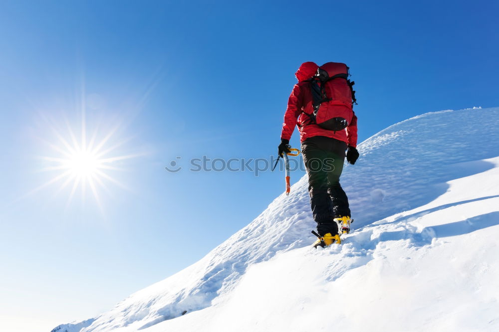 Similar – Image, Stock Photo Mountaineer faces a climb at the top of a snowy peak.