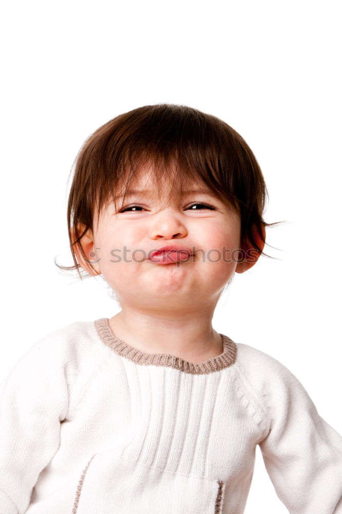 Boy straightens his tie and looks in the air