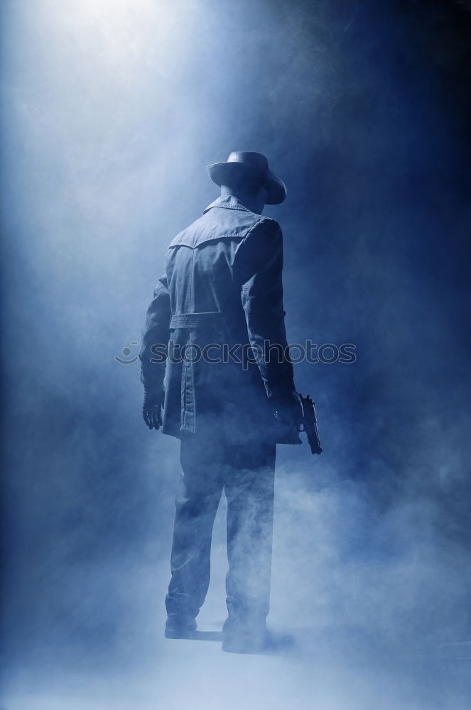 Similar – Woman wearing trench coat and standing in fog