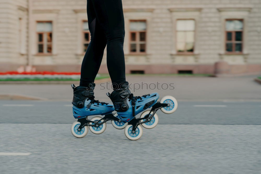 Similar – Woman jumping barefoot over blue rubber hills